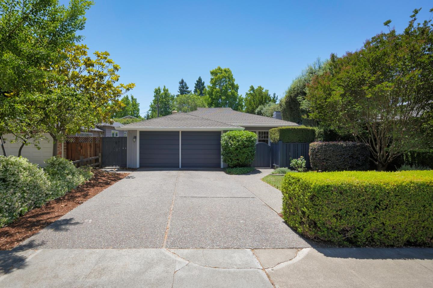 front of the house with beautiful hedges